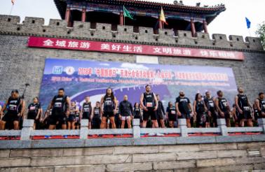 A group of runners from New Zealand preform a traditional haka before the start of The Great Wall Marathon.